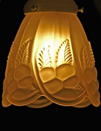 The style of the glass globe on a lamp can help date the lamp.