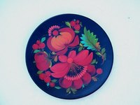 Place images on china plates using decals.