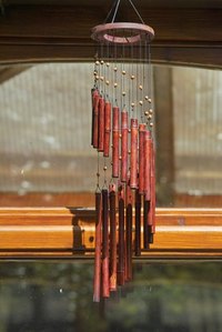 Repair wind chimes using replacement nylon string.