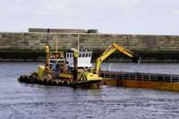 Marine construction companies operate barge-mounted work equipment.