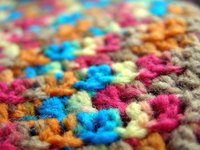 Use multi-color yarn to create a unique crochet beanbag chair.