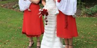 Suggest your guests wear outfits in your wedding colors to coordinate photos.