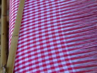 Make your own blanket on a handmade blanket weaving loom.
