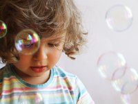 A child blowing bubbles