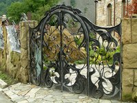 A beautifully ornate wrought iron garden gate