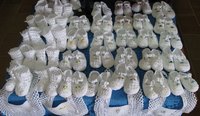 Hand-knitted booties warm the feet of the baby and the heart of the mother.