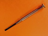 A jeweler's screwdriver will help you remove the watch's back plate.