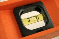 A spirit level's vial consists of liquid, traditionally called "spirits," and an air bubble.