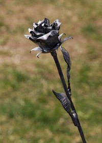 Render roses in metal.