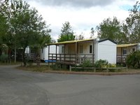 A well-kept mobile home in a clean park.