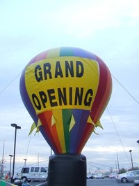 Ribbon cutting is a traditional part of grand opening events.