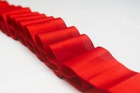 Satin ribbon is pleated on a string to form the lei's "petals."