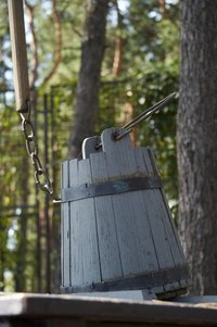 Leave wooden buckets natural to fade with age, creating a rustic effect.