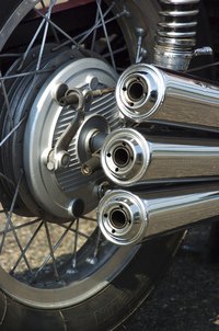 Mufflers are hot enough to burn skin.