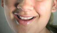 A good customer service associate smiles with sincerity.