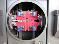 A meter base is the mount for a watt-hour meter that measures electricity use.