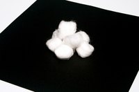 Dye cotton balls yellow for various craft projects.