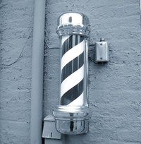 Painting a spiral on a pole can be done with only a few common painting tools.