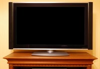 Securing a tabletop flat panel television provides protection from tipping accidents.