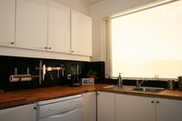 Plugging in items close to the sink is not a problem if the outlet is ground-fault certified.