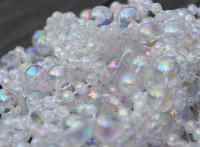 Clear or irridescent glass beads represent air bubbles in your dollhouse aquarium.