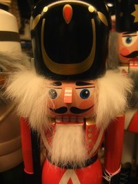 The nutcracker is decorative, with rich, vibrant colors.