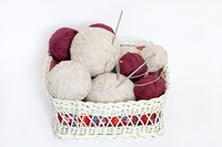 Dry heat or hot water can soften circular knitting needle cables.