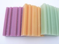 You can make paper boxes to hold gift soaps.