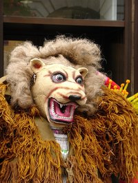Make an animal mask with papier mache.