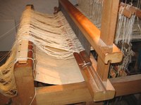A large loom is used to make handcrafted textiles.