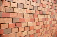 Use a core drill with a masonry bit to make a round hole for a dryer vent in a brick wall