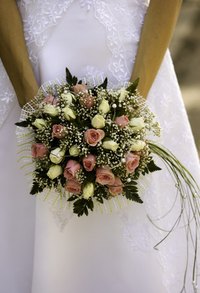 Handmade paper wedding bells enhance a bridal shower.