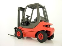 A forklift facilitates material handling on the shop floor.
