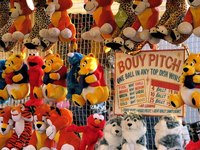 Carnival game operators use probability formulas to make winning difficult.