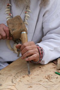 A wood carver at work.