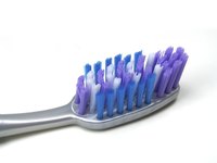 Brushing regularly can prevent dark splotches on a tooth crown.