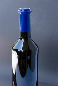 A kiln can soften this bottle until it can be stretched.
