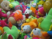 Embroider friendly eyes on a stuffed animal.