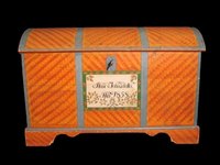 Liven up an old chest with wallpaper.