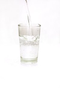 Make a prism with a glass of water.