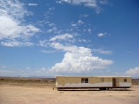 Exterior studs in mobile home trailers should be 16 inches apart.