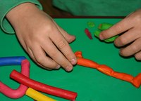 Child care workers assist children with indoor and outdoor activities.