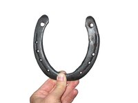 Weld several horseshoes together to form the frame of a chair