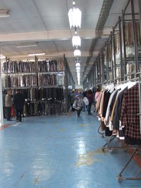 Dry cleaners protect clean clothes with clear plastic bags