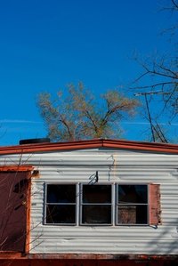Upgrade the roof of a mobile home quickly with peel-and-stick roofing.