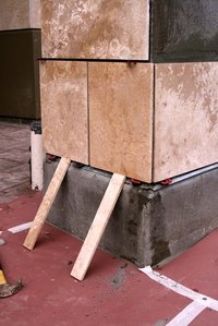 Special techniques are needed to install large tiles vertically.