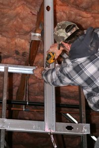 Metal studs are fastened with screws designed to penerate the flange of the metal stud