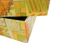 Cover cardboard boxes with fabric.