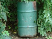 Old 55-gallon barrels can be converted to a wood stove.