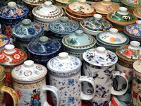 A fancy china teapot accenuates the Victorian theme of a tea party.